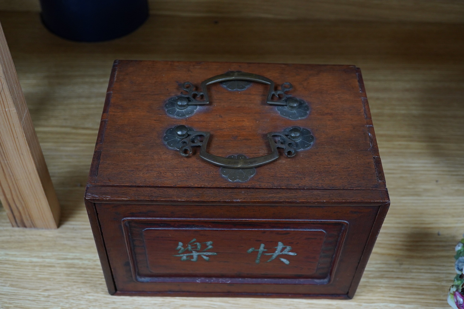 An early 20th century Chinese Mah Jong set, with bone tiles, 22cm x 15.5cm x 14.5cm. Condition - fair, one drawer front replaced